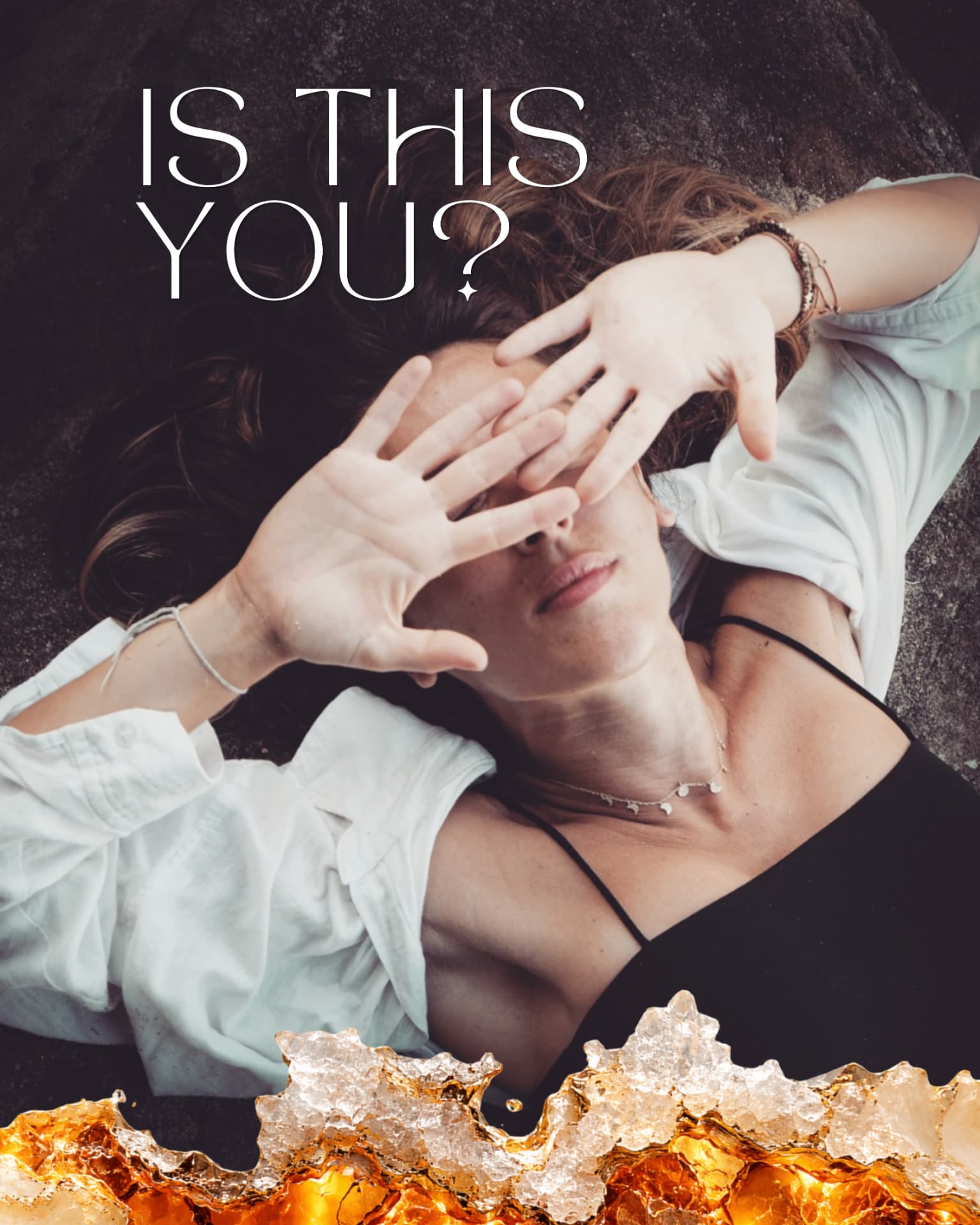 A woman lying back with her hands resting across her face, crystals in the foreground